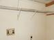 Unfinished storage room with open shelving and water hookups at 6654 Wisteria Dr., Myrtle Beach, SC 29588