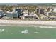 Stunning aerial view of a beachfront community, showcasing the coastline, beach and ocean at 7300 Porcher Dr. # 11, Myrtle Beach, SC 29572