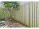 Fenced yard with camellia bushes in bloom providing a private and colorful outdoor area at 7300 Porcher Dr. # 11, Myrtle Beach, SC 29572