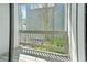 View from the balcony showcasing lush greenery and neighborhood scenery at 7300 Porcher Dr. # 11, Myrtle Beach, SC 29572