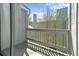 The condo includes a private balcony with views of the surrounding lush greenery and landscape at 7300 Porcher Dr. # 11, Myrtle Beach, SC 29572