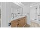 Bathroom featuring double sink vanity, framed mirror and a tiled walk-in shower at 7300 Porcher Dr. # 11, Myrtle Beach, SC 29572