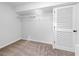 A well-lit closet space with wire shelving and ample storage, complemented by a louvered door at 7300 Porcher Dr. # 11, Myrtle Beach, SC 29572