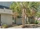 View of a gray home exterior featuring a mature palm tree at 7300 Porcher Dr. # 11, Myrtle Beach, SC 29572