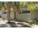 Charming gray home exterior featuring a mature palm tree and lovely landscaping at 7300 Porcher Dr. # 11, Myrtle Beach, SC 29572