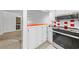 Bright kitchen with white cabinets and stainless steel appliances at 7300 Porcher Dr. # 11, Myrtle Beach, SC 29572