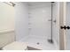 Bright tiled walk-in shower in a bathroom with a small window at 7300 Porcher Dr. # 11, Myrtle Beach, SC 29572