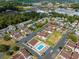 Aerial view of the condo community showcasing pool area, parking and surrounding greenery at 800 9Th Ave. S # T3, North Myrtle Beach, SC 29582