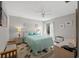 Bright bedroom featuring neutral walls, ceiling fan, and a serene view from the window at 800 9Th Ave. S # T3, North Myrtle Beach, SC 29582