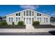 Exterior of community clubhouse with glass windows, double doors and landscaped entrance at 800 9Th Ave. S # T3, North Myrtle Beach, SC 29582