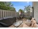Private patio with outdoor furniture, perfect for relaxing or entertaining, surrounded by a wooden fence at 800 9Th Ave. S # T3, North Myrtle Beach, SC 29582