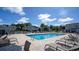 Community pool with lounge chairs and tables, surrounded by well-kept landscaping at 800 9Th Ave. S # T3, North Myrtle Beach, SC 29582