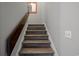 Staircase featuring modern wood stairs, white risers and light gray walls at 800 9Th Ave. S # T3, North Myrtle Beach, SC 29582