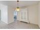 Dining area featuring tile floors, a hanging light fixture, and a built-in display cabinet at 81 Safe Harbor Ave., Pawleys Island, SC 29585