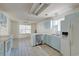 Bright kitchen with tile flooring, modern appliances, and ample counter space, with a view to the dining area at 81 Safe Harbor Ave., Pawleys Island, SC 29585