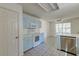 Charming kitchen with retro-style cabinets, stainless steel appliances, and breakfast bar at 81 Safe Harbor Ave., Pawleys Island, SC 29585