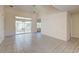 Bright, open living area featuring tile flooring, vaulted ceilings, and sliding glass doors to the outdoors at 81 Safe Harbor Ave., Pawleys Island, SC 29585