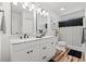 Bright bathroom featuring a double vanity with modern fixtures and a decorative mirror at 837 Flicker Pl., Murrells Inlet, SC 29576