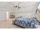 Spacious bedroom with a large bed, neutral carpet, and a view of the backyard at 837 Flicker Pl., Murrells Inlet, SC 29576