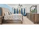 Coastal bedroom featuring a king bed, ceiling fan, and stylish nautical decor at 837 Flicker Pl., Murrells Inlet, SC 29576