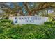 Community entrance sign for Mount Gilead Place with lush landscaping surrounding the base at 837 Flicker Pl., Murrells Inlet, SC 29576