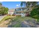 Charming home with a welcoming front porch, a well-maintained lawn, and mature landscaping at 837 Flicker Pl., Murrells Inlet, SC 29576