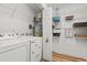 Functional laundry room with modern appliances and ample shelving for storage at 837 Flicker Pl., Murrells Inlet, SC 29576