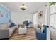 Cozy living room with a comfortable sofa, desk, and stylish accents at 837 Flicker Pl., Murrells Inlet, SC 29576