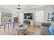 Cozy living room showcasing comfortable seating, stylish decor, and natural light from the window at 837 Flicker Pl., Murrells Inlet, SC 29576