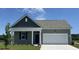 Charming single-story home with a well-manicured lawn, a two-car garage, and lovely curb appeal at 886 Farmers Passage Loop, Loris, SC 29569