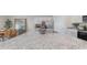 Spacious kitchen island featuring granite countertops, stainless steel sink, and a view to the dining area at 886 Farmers Passage Loop, Loris, SC 29569