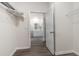 Walk-in closet leads to a bright bathroom featuring a glass-enclosed shower, dual sink vanity at 886 Farmers Passage Loop, Loris, SC 29569