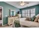 Bright bedroom featuring an accent wall, plush bedding, and white window shutters at 901 West Port Dr. # 2101, North Myrtle Beach, SC 29582