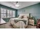 Cozy bedroom with an accent wall, white furnishings, and bright, natural light at 901 West Port Dr. # 2101, North Myrtle Beach, SC 29582