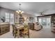 Dining room with a rustic wooden table and chairs, adjacent to the living area at 901 West Port Dr. # 2101, North Myrtle Beach, SC 29582