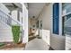 Inviting condo entrance with a covered walkway and staircase to the upper level at 901 West Port Dr. # 2101, North Myrtle Beach, SC 29582
