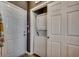 Convenient laundry closet with stacked washer and dryer next to the entryway at 901 West Port Dr. # 2101, North Myrtle Beach, SC 29582