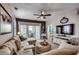 Inviting living room with a sectional sofa, ceiling fan, and sliding glass doors at 901 West Port Dr. # 2101, North Myrtle Beach, SC 29582