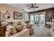 Comfortable living room with a sectional sofa, ceiling fan, and access to the patio at 901 West Port Dr. # 2101, North Myrtle Beach, SC 29582