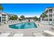 Outdoor pool surrounded by lounge chairs and lush landscaping, ideal for relaxation at 901 West Port Dr. # 2101, North Myrtle Beach, SC 29582