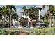 A backyard featuring a pool, landscaping, a pergola with dining furniture, and multiple balconies at 918 Strand Ave., North Myrtle Beach, SC 29582