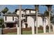 Side view of a modern home with dark trim, balconies, and tropical landscaping at 918 Strand Ave., North Myrtle Beach, SC 29582