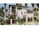 A rear exterior view highlighting the multiple balconies and stairs, pool, and lush landscaping at 918 Strand Ave., North Myrtle Beach, SC 29582