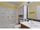 Clean bathroom featuring a shower-tub combo and well-lit vanity area at 9580 Shore Dr. # 311, Myrtle Beach, SC 29572