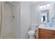 Well-lit bathroom featuring a shower and wood vanity with mirror at 9580 Shore Dr. # 311, Myrtle Beach, SC 29572