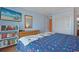 Airy bedroom showcasing dresser, decorative shelving, and mounted flatscreen at 9580 Shore Dr. # 311, Myrtle Beach, SC 29572