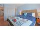 Comfortable bedroom with woven headboard, decorative pillows, and closet at 9580 Shore Dr. # 311, Myrtle Beach, SC 29572