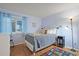 Comfortable bedroom with twin bed, bright window, and hardwood floors at 9580 Shore Dr. # 311, Myrtle Beach, SC 29572
