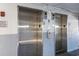 Building elevators, featuring multiple call buttons and signs with instructions for use at 9580 Shore Dr. # 311, Myrtle Beach, SC 29572