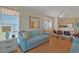 Bright living area with comfortable seating, a TV, and an open dining area at 9580 Shore Dr. # 311, Myrtle Beach, SC 29572